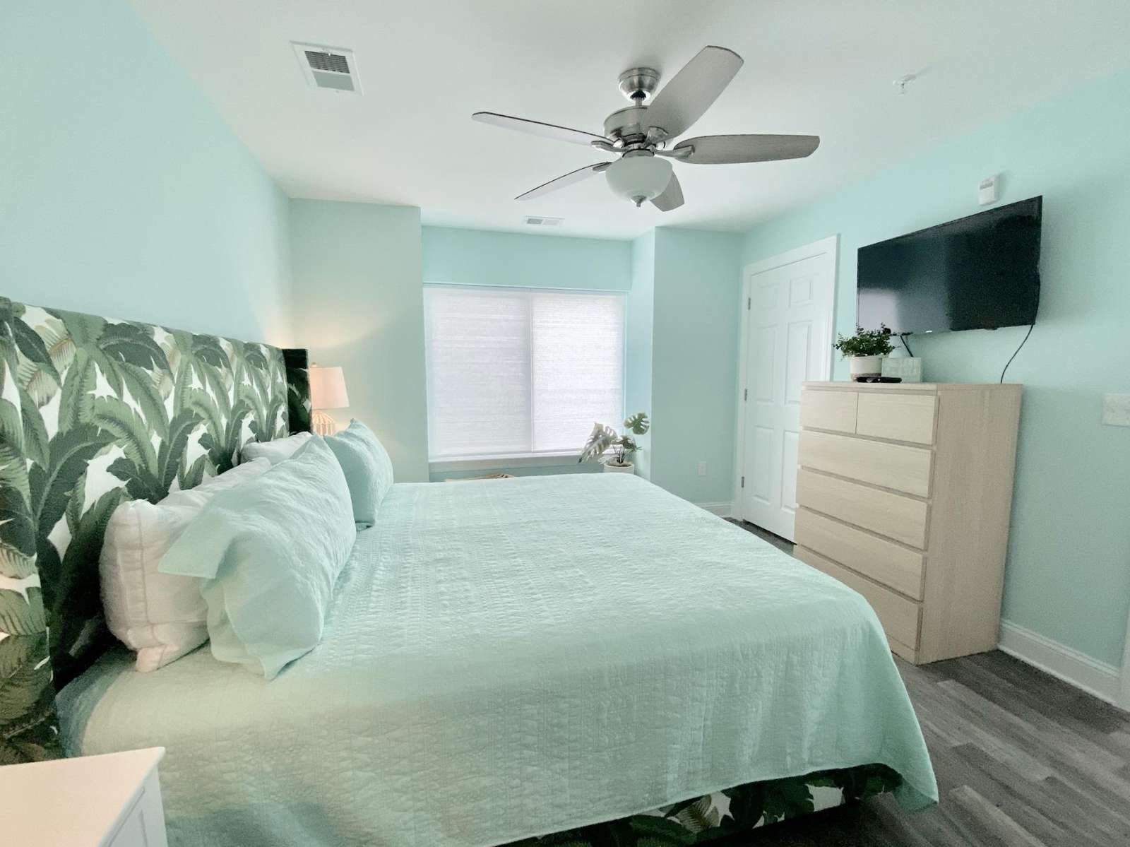 Master bedroom, flat screen TV, ceiling fan