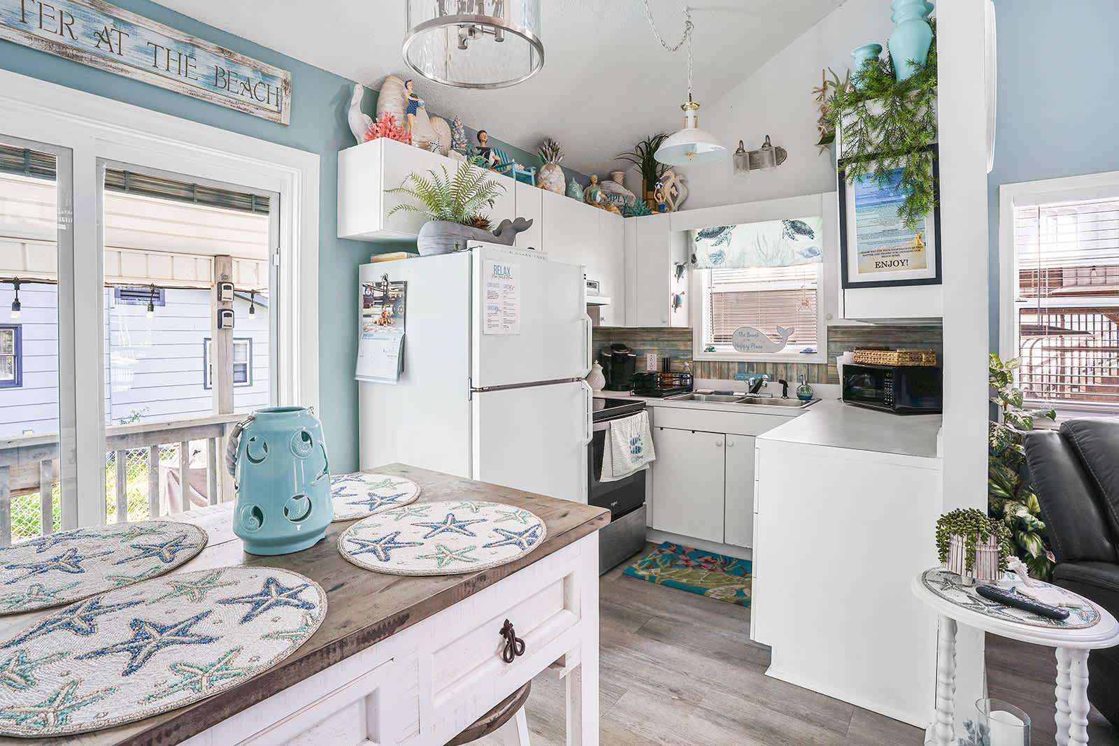 Cozy kitchen with charming vintage touches and natural light - property