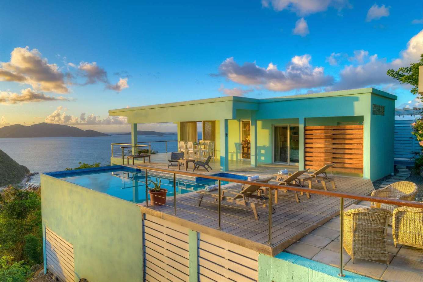 Sunlit patio with panoramic ocean and mountain views