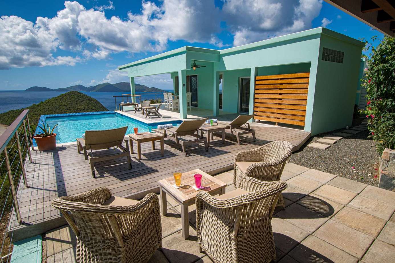 Sun-drenched patio with panoramic ocean views and cozy seating