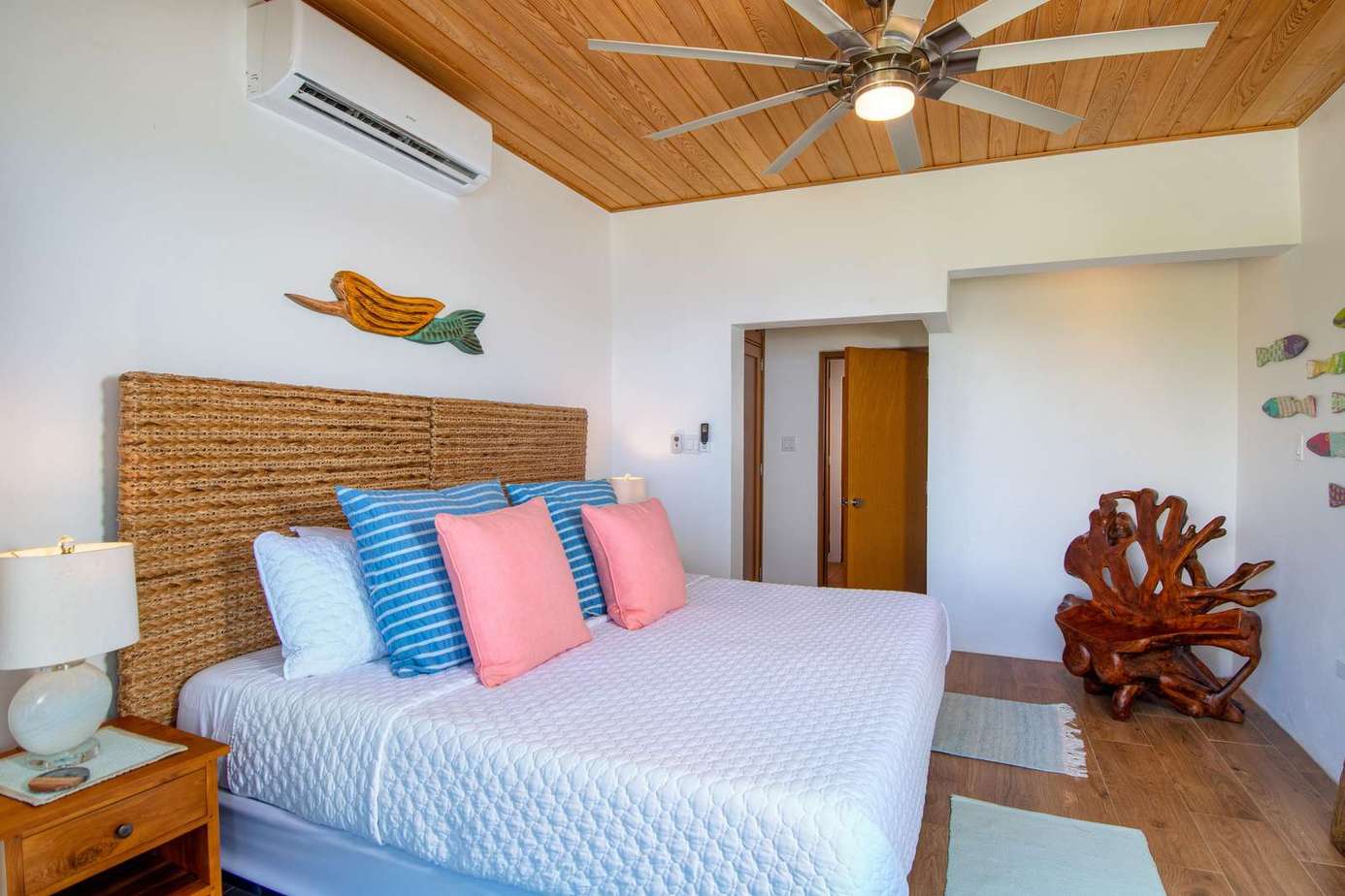 Cozy bedroom retreat with tropical wood accents and vibrant decor