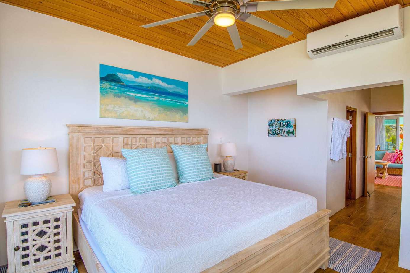 Cozy bedroom retreat with tropical decor and ceiling fan