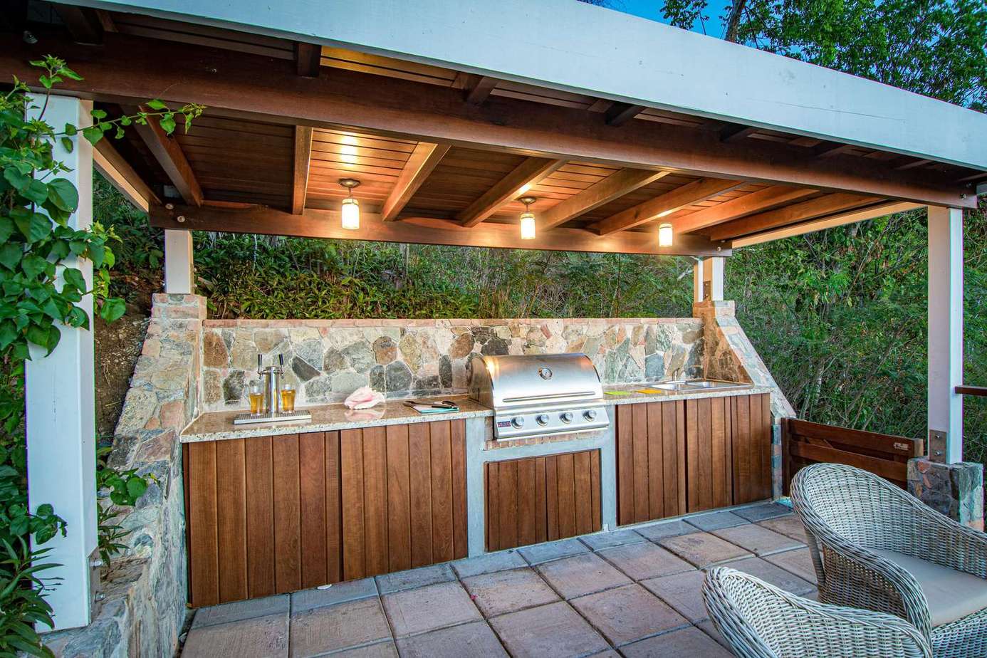 covered BBQ area next to the pool