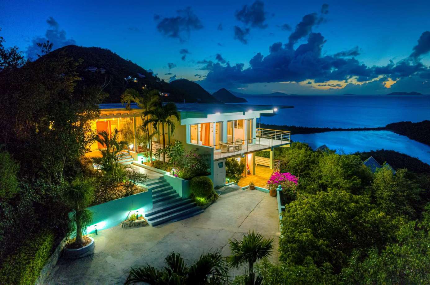 Secluded hillside retreat with stunning ocean views at dusk