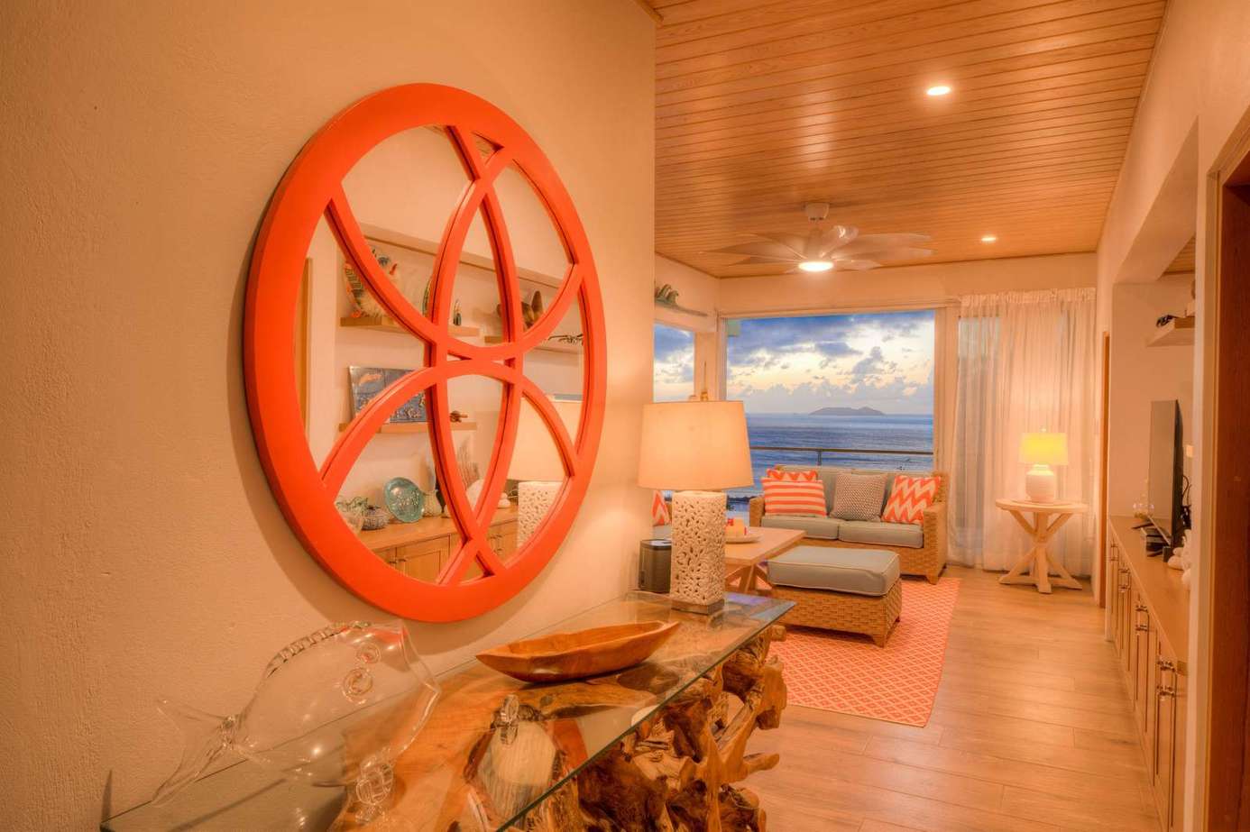 Cozy living room with vibrant decor and sunset views