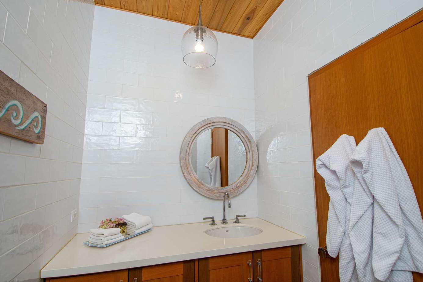 Bright bathroom with modern fixtures and cozy wooden accents