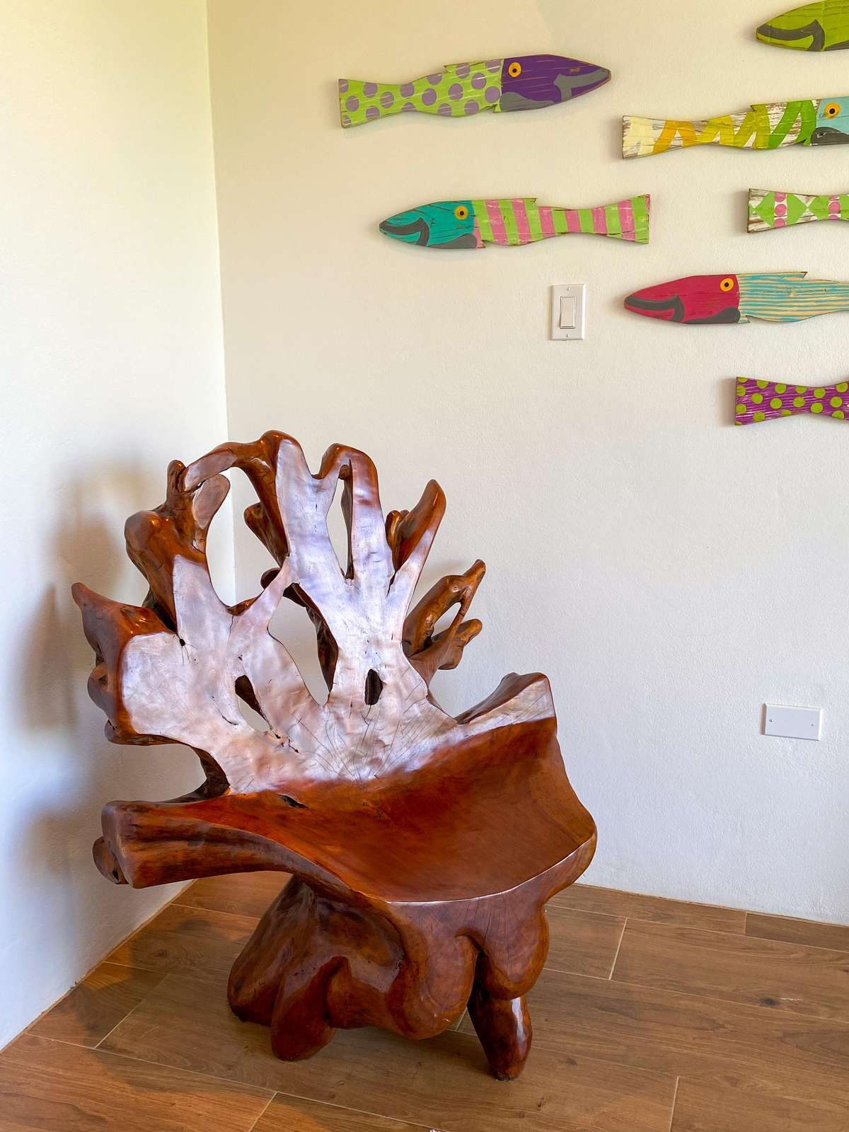 Artistic wooden chair adds charm to cozy corner space