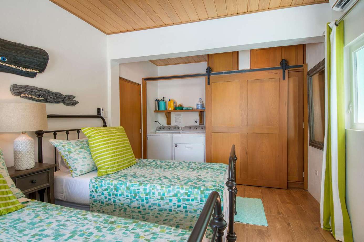 Cozy twin bedroom with vibrant accents and ample storage