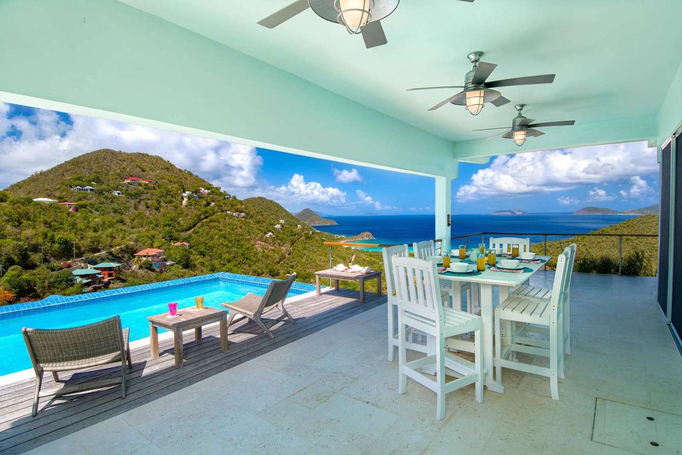 Spacious covered patio with stunning hillside and water views