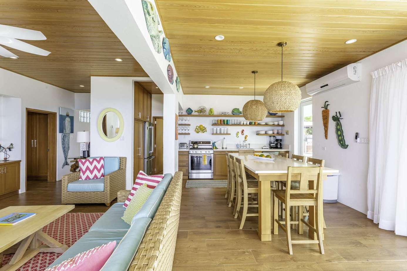 Spacious open kitchen and dining area with cozy seating nook