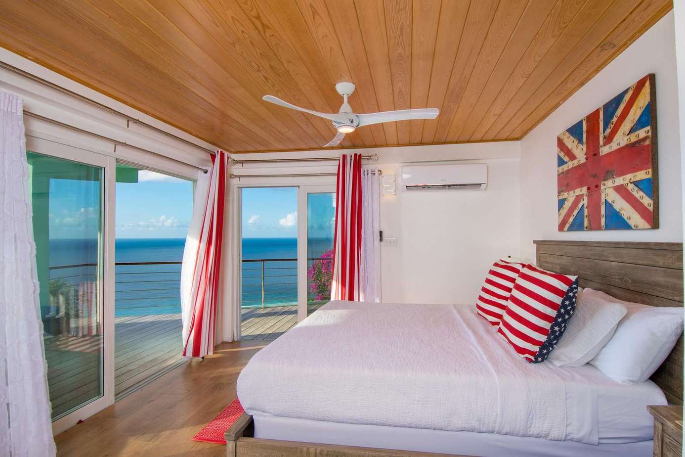 Cozy bedroom with ocean views and vibrant decor