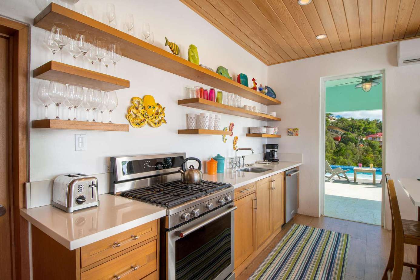 Bright, airy kitchen with modern appliances and open shelving