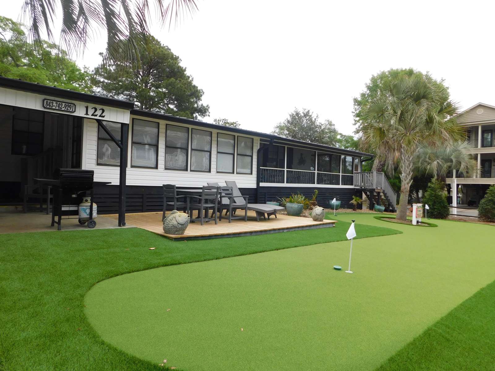 MH122, new putt putt area in front yard - property