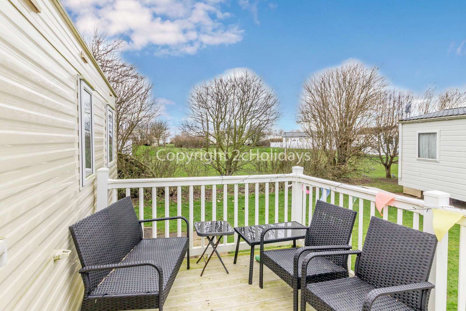 Enclosed decking with outdoor furniture for you to enjoy use of, perfect for families!