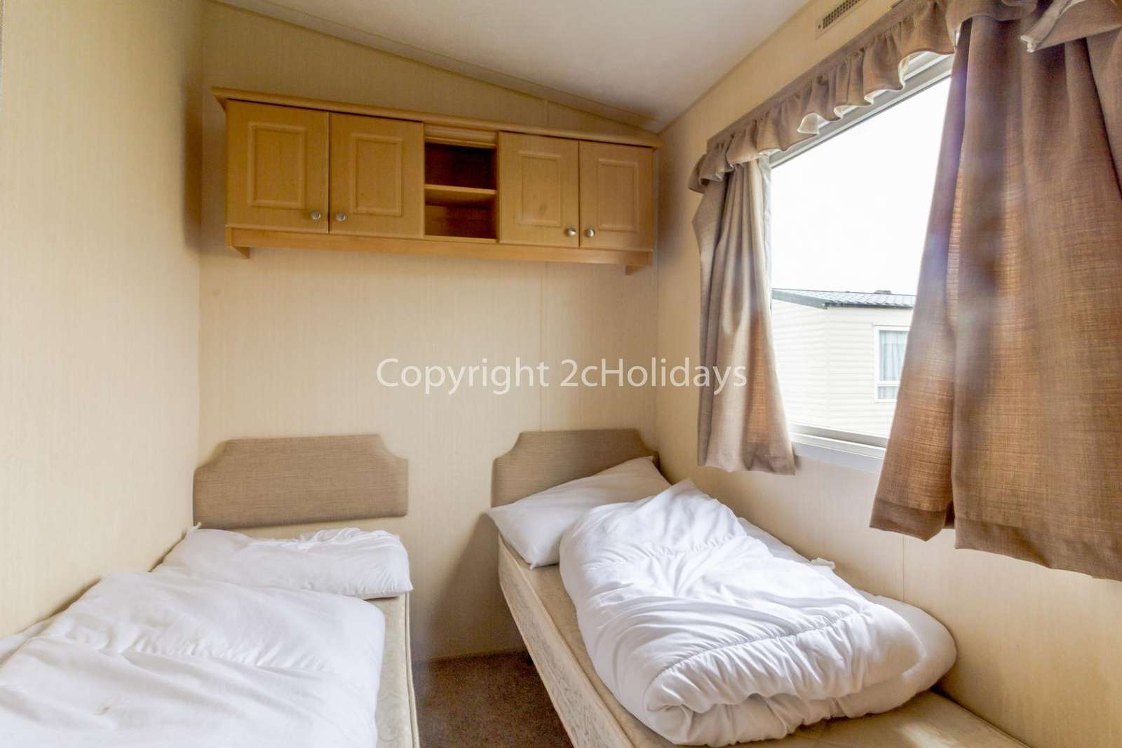 You can find plenty of storage in this twin bedroom!