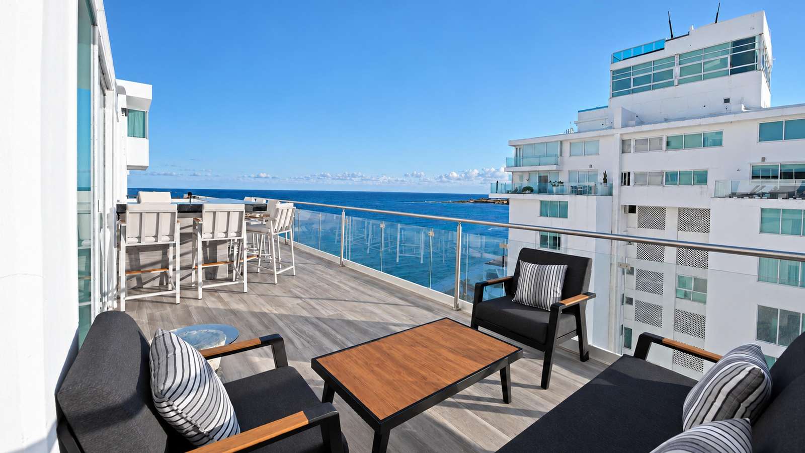 Large terrace with a Caribbean-view and a lagoon view at Penthouse 3704, a Cancun vacation rental by Tim’s Ocean Condos. - property