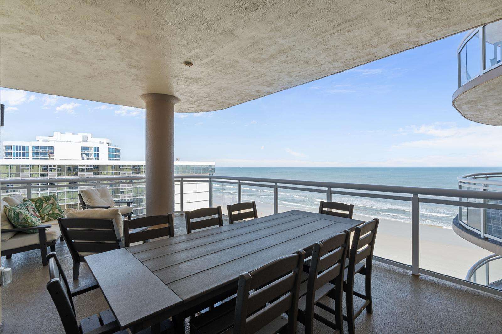 Spacious oceanfront balcony with dining for eight - property
