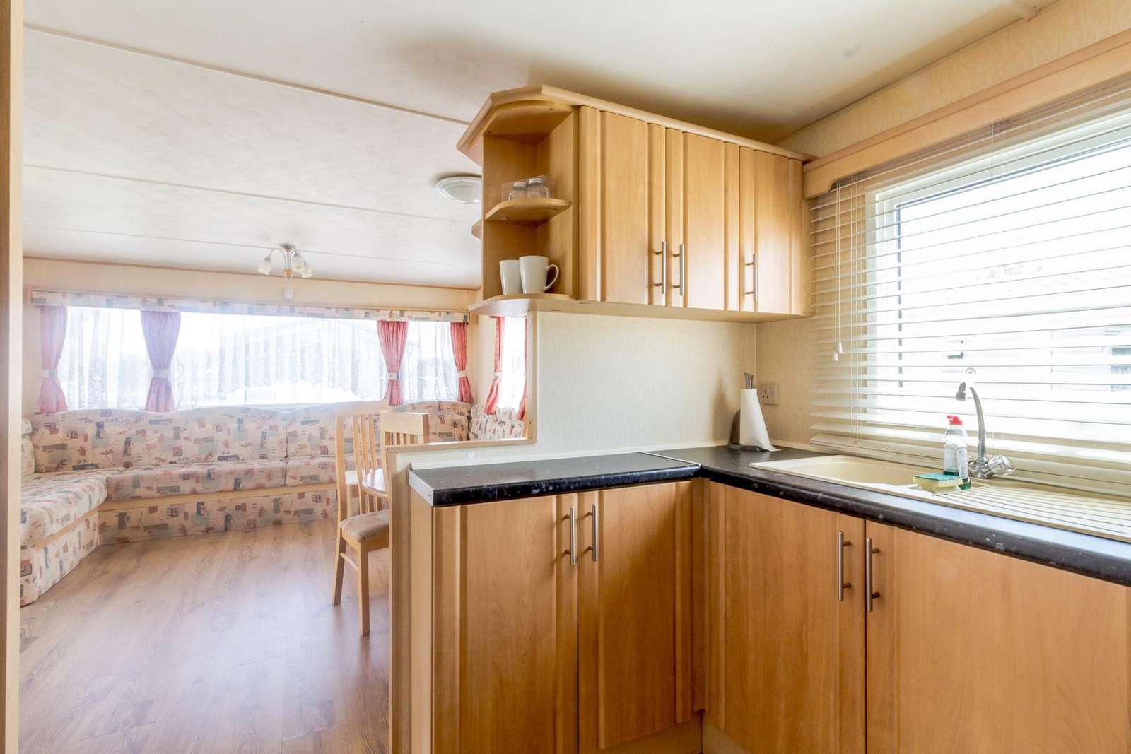 Modern kitchen leading to spacious lounge
