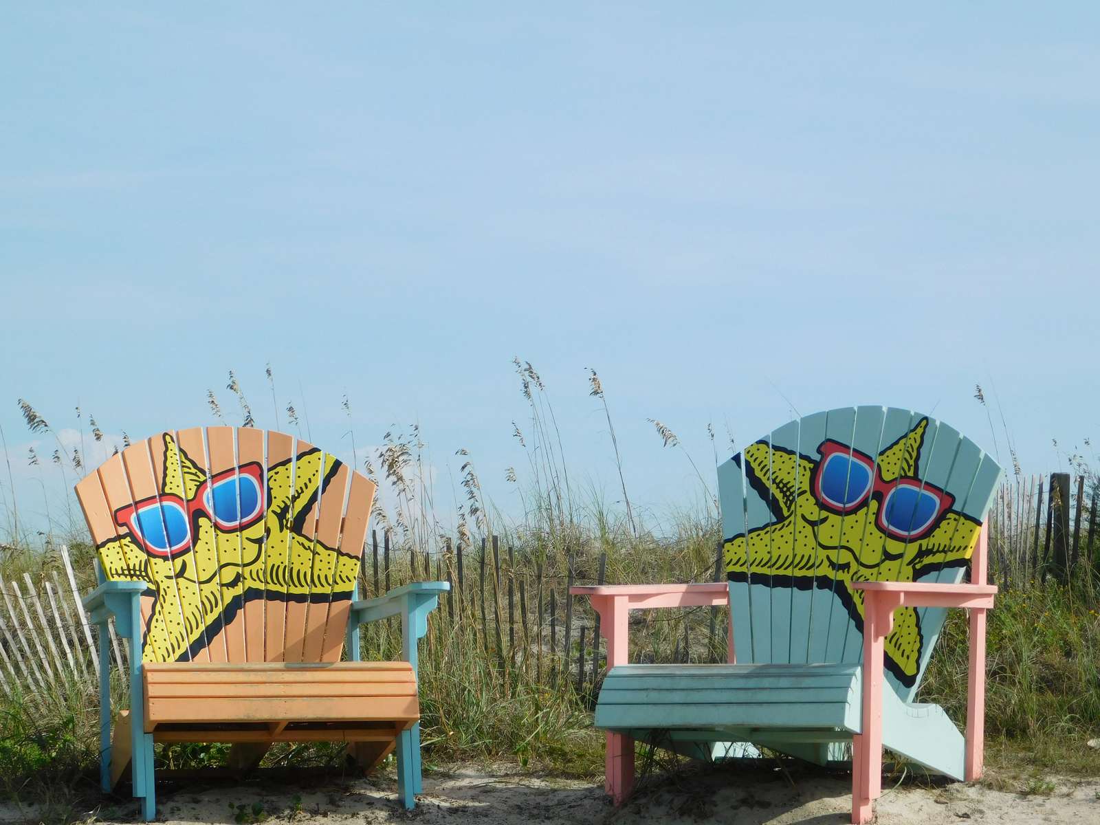 Take a photo in the chairs at the beach