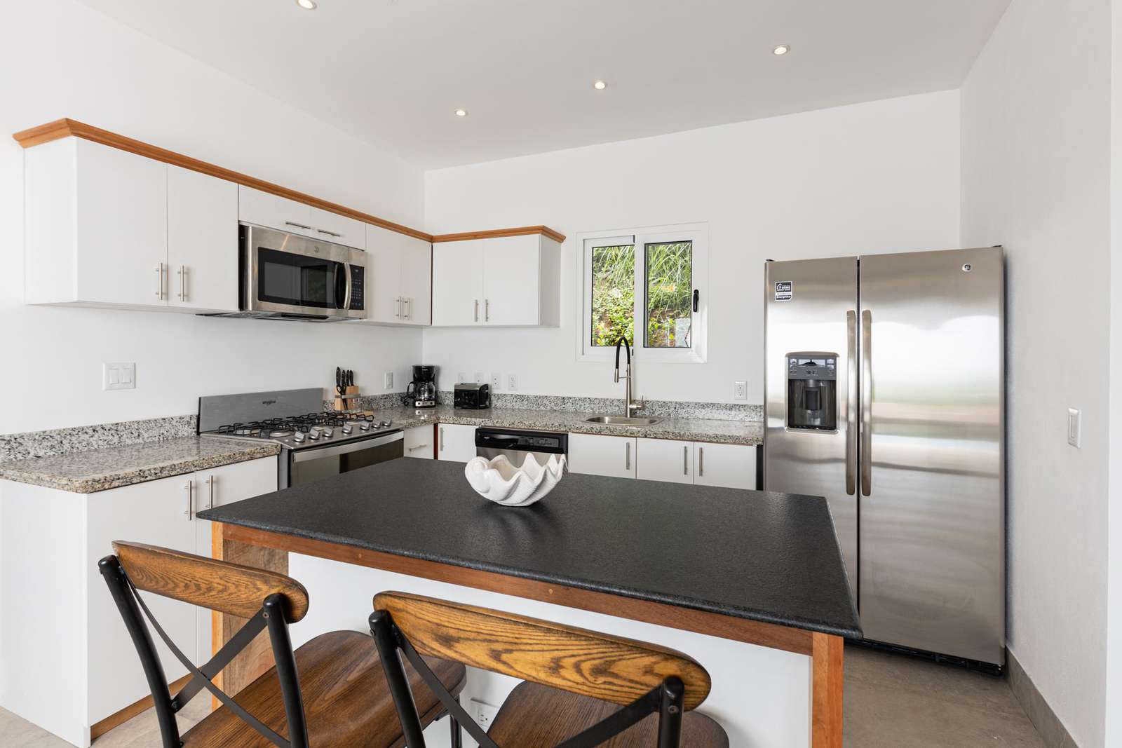 Fully stocked kitchen with breakfast bar