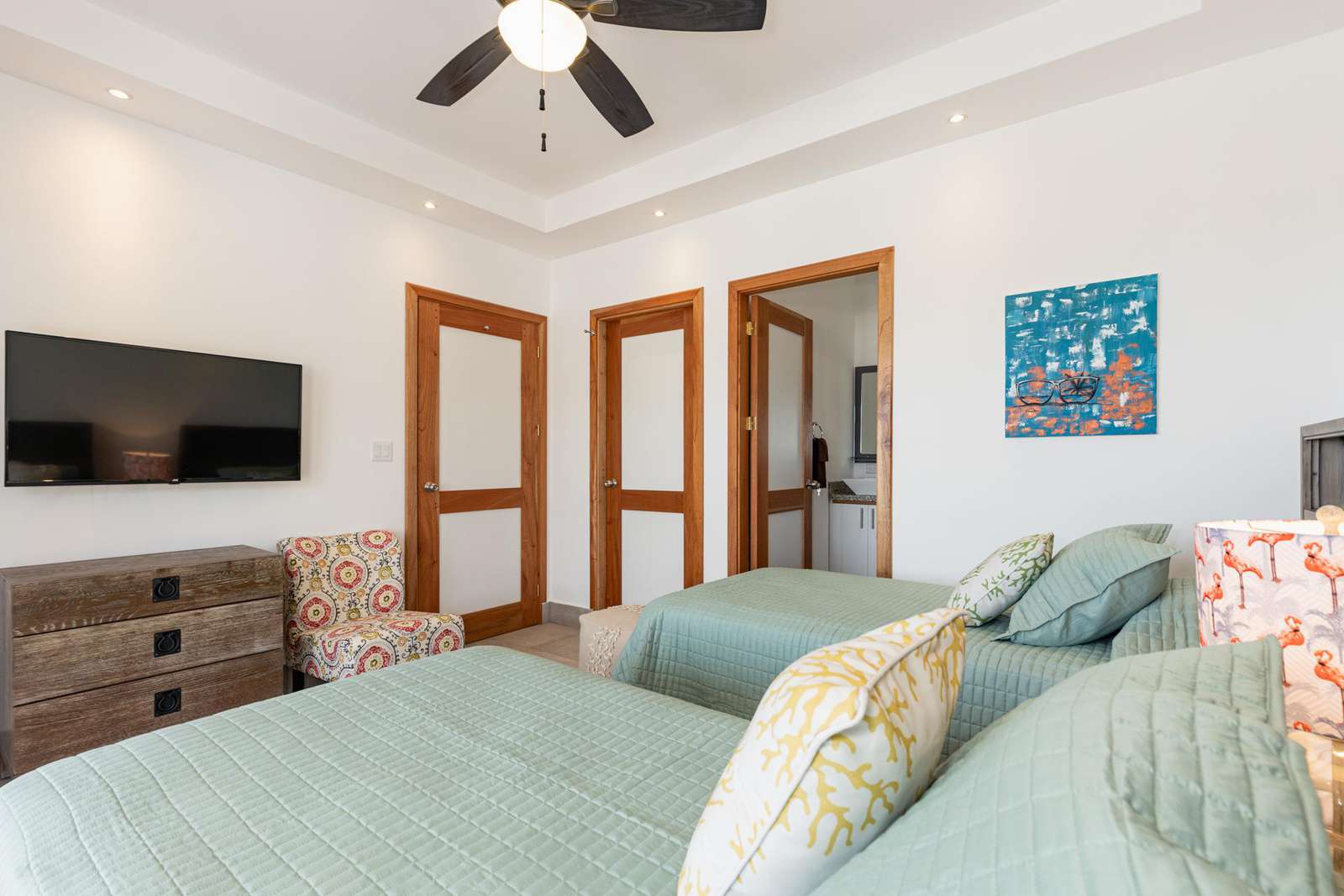 Guest bedroom, twin beds, smart TV, walk in closet