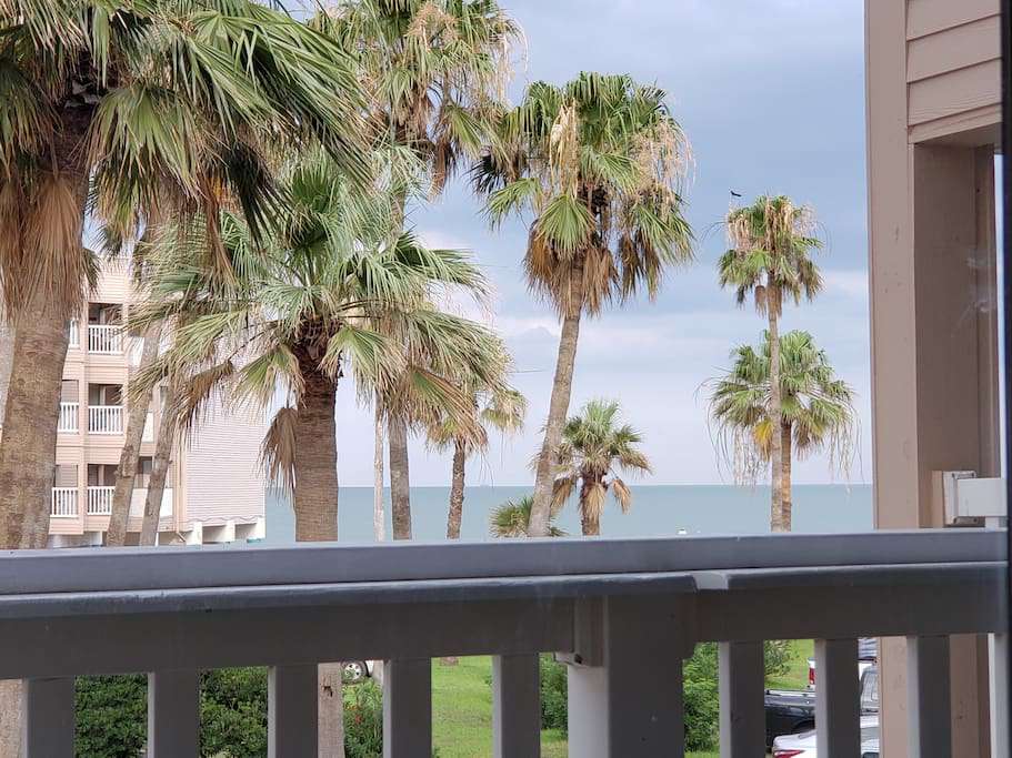 Directly over the pool out the front door, and a tropical view of the beach and water from the balcony!
Good location!