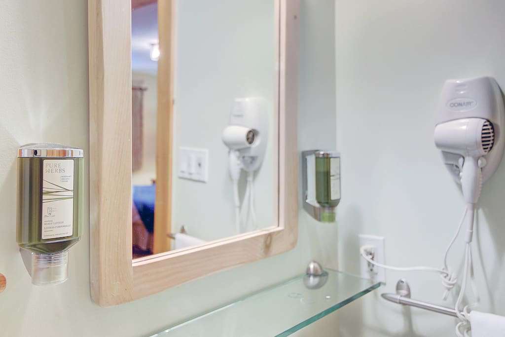 Washroom with showel gel,shampoo and hair dryer
