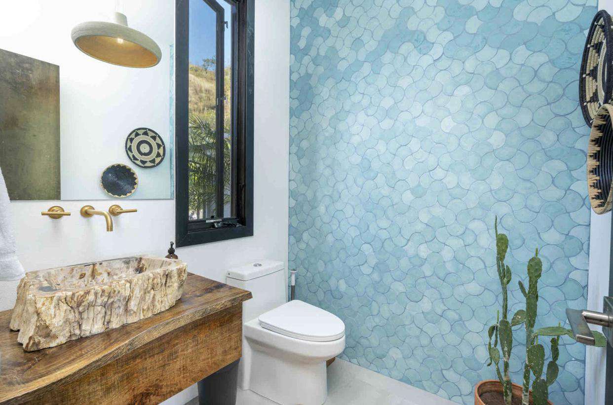 Guest 1/2 bathroom, teak countertops, petrified wood sink