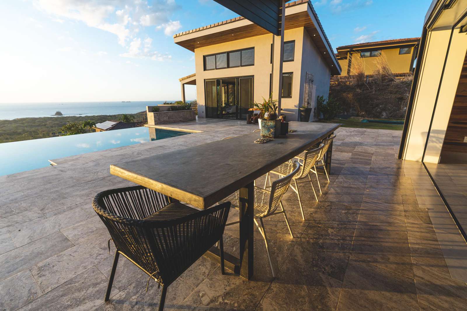 View of detached apartment and outdoor dining area