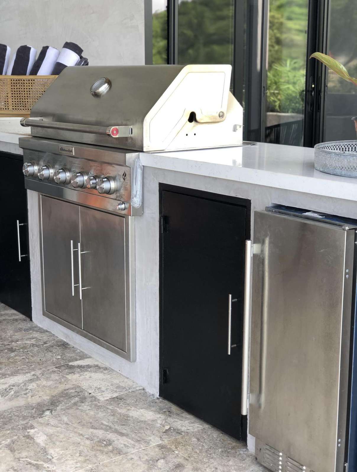 Outdoor kitchen area, BBQ gas grill, icemaker, refrigerator