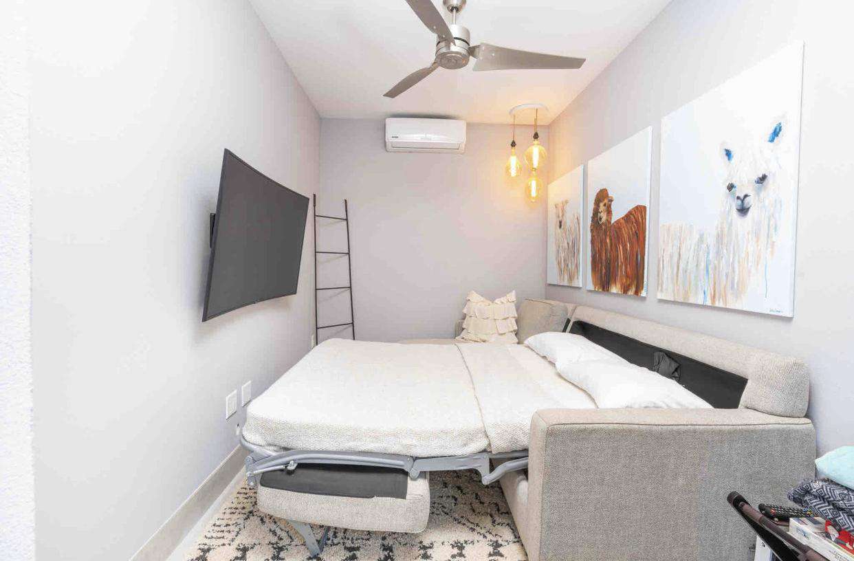 Bonus room, sleeper sofa (shown as a bed), flat screen TV