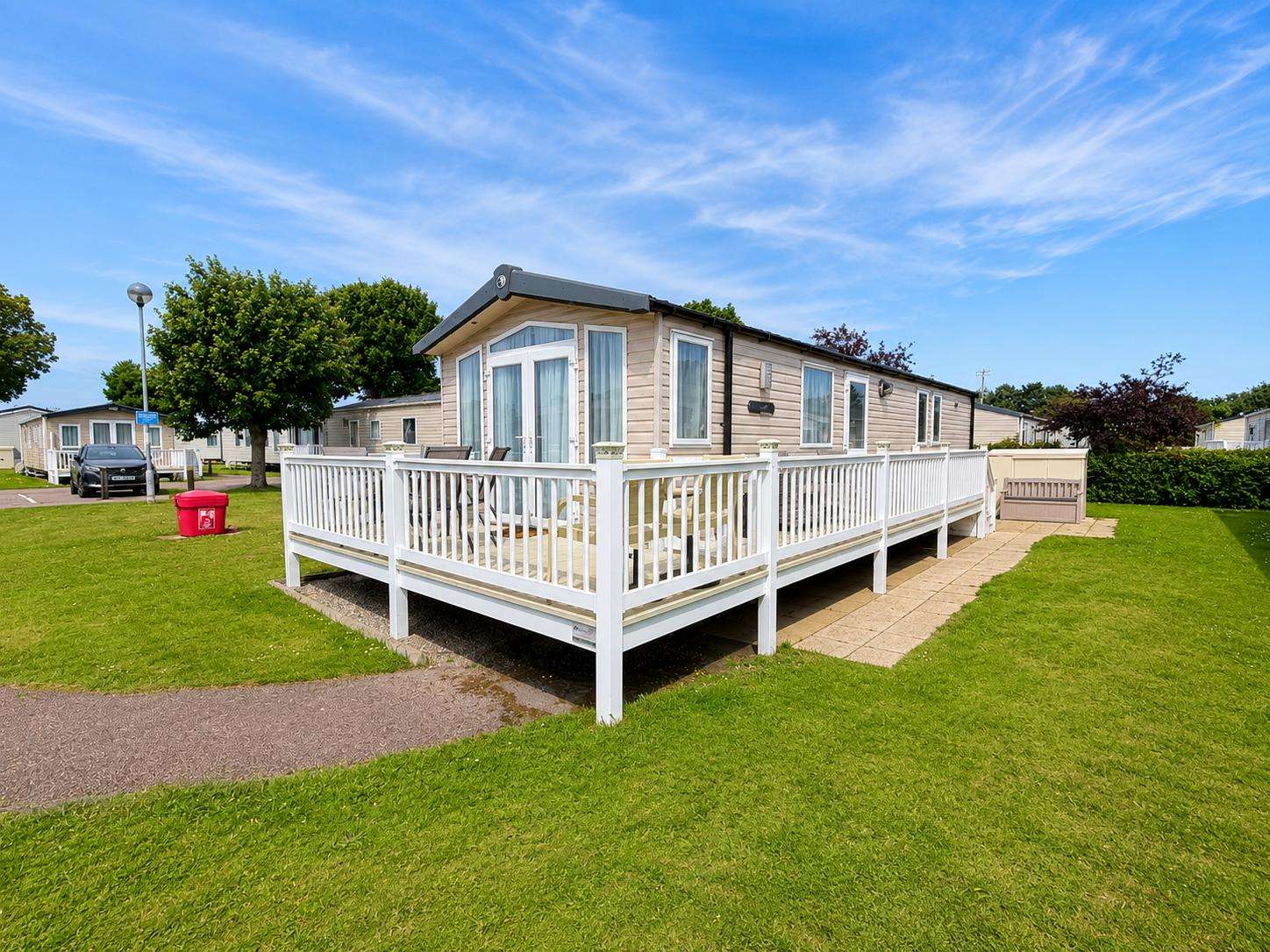 Enjoy a stay at Seashore in Great Yarmouth, you will love relaxing on the decking in the Summer sunshine. - property