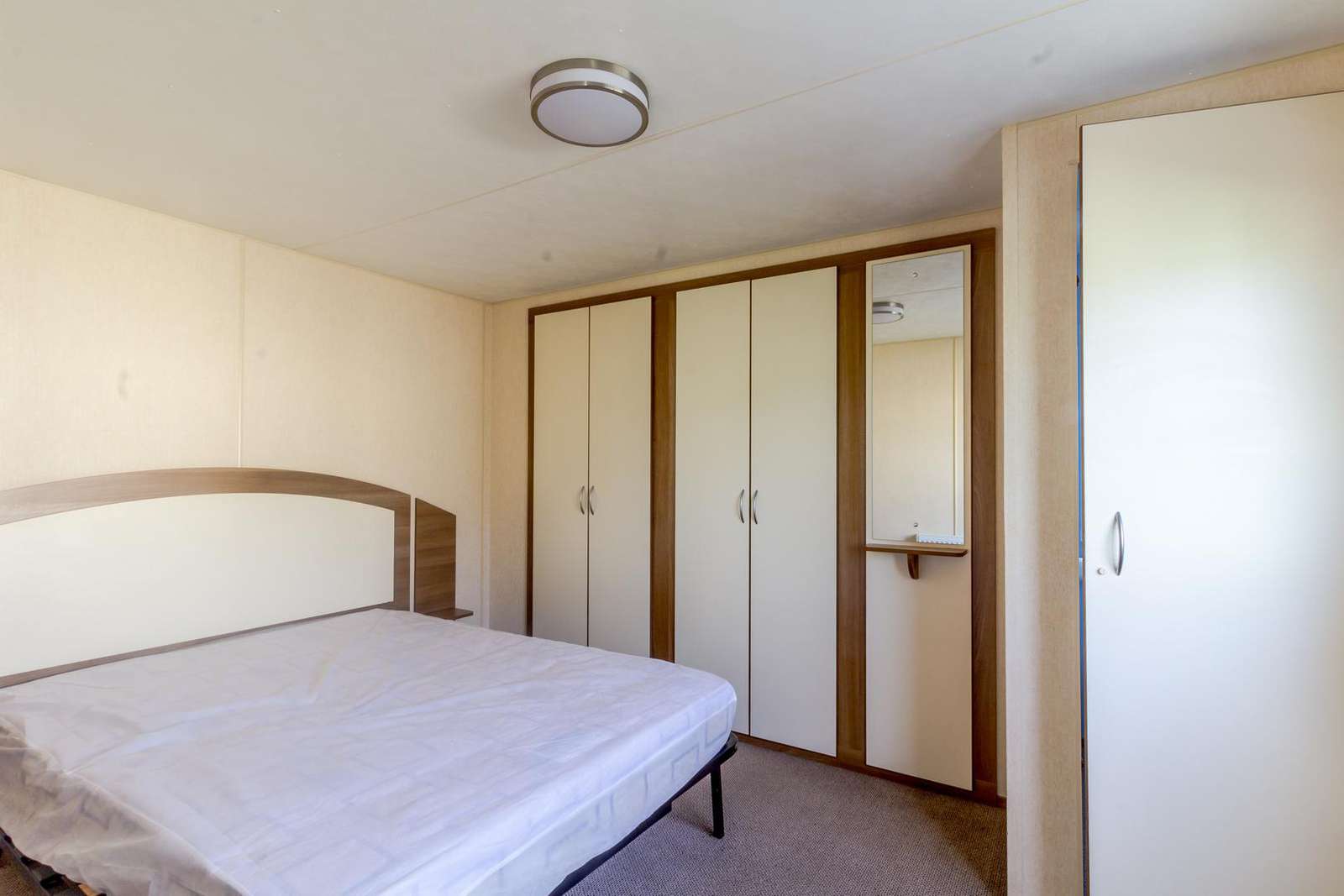 You can find plenty of storage in this master bedroom