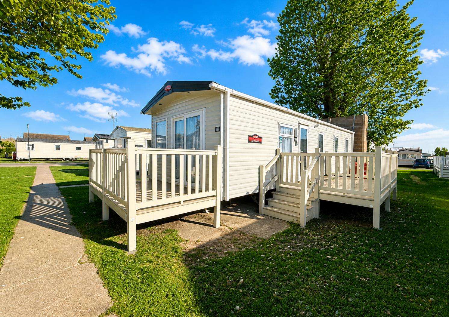 Enjoy a stay at Highfield Grange in Essex at this modern caravan. Sleeping 8 people its the perfect base for a holiday on the Essex coast. Enjoy the sun on the large decking. - property