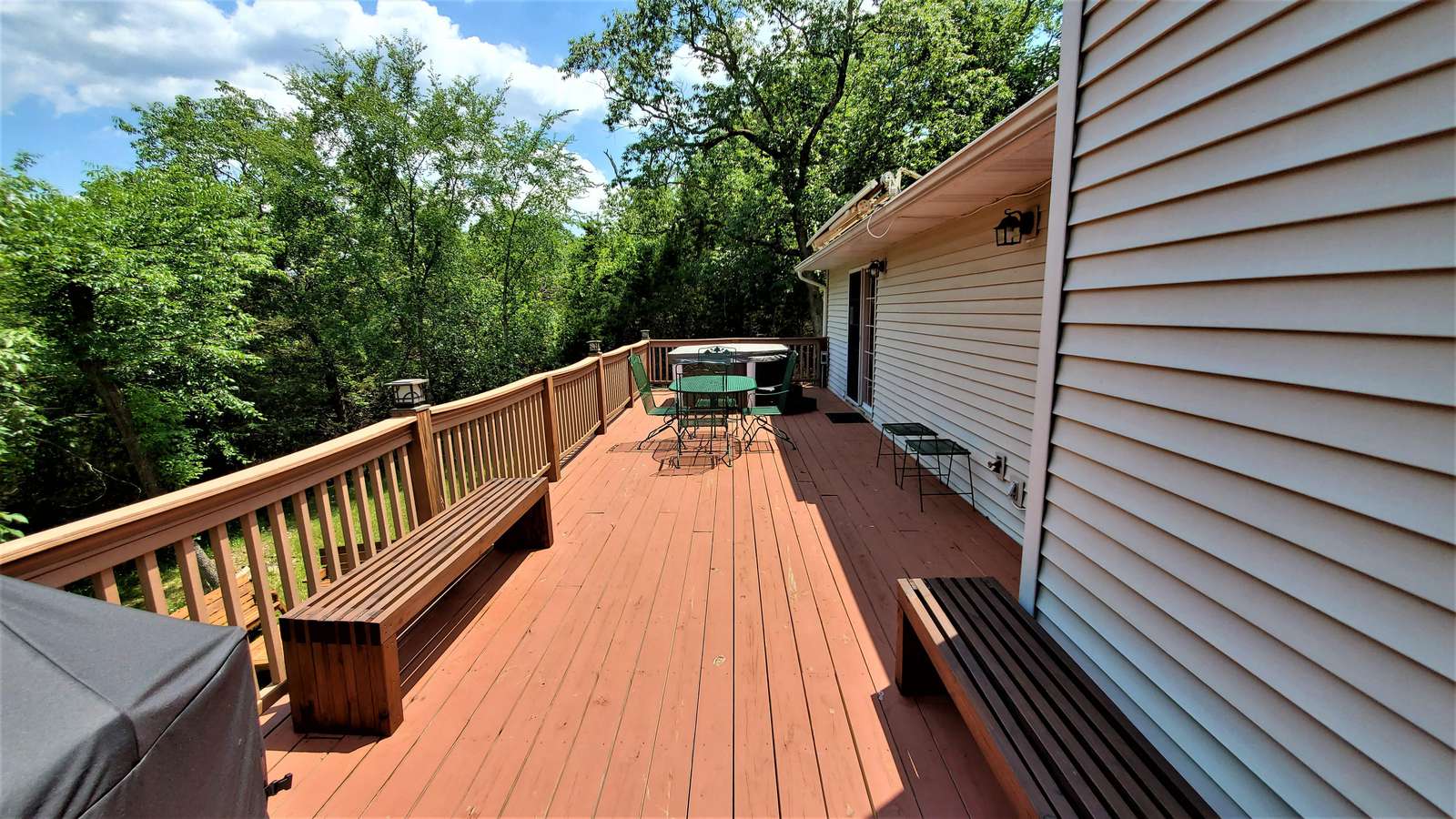Large deck with hot tub and roll out awning