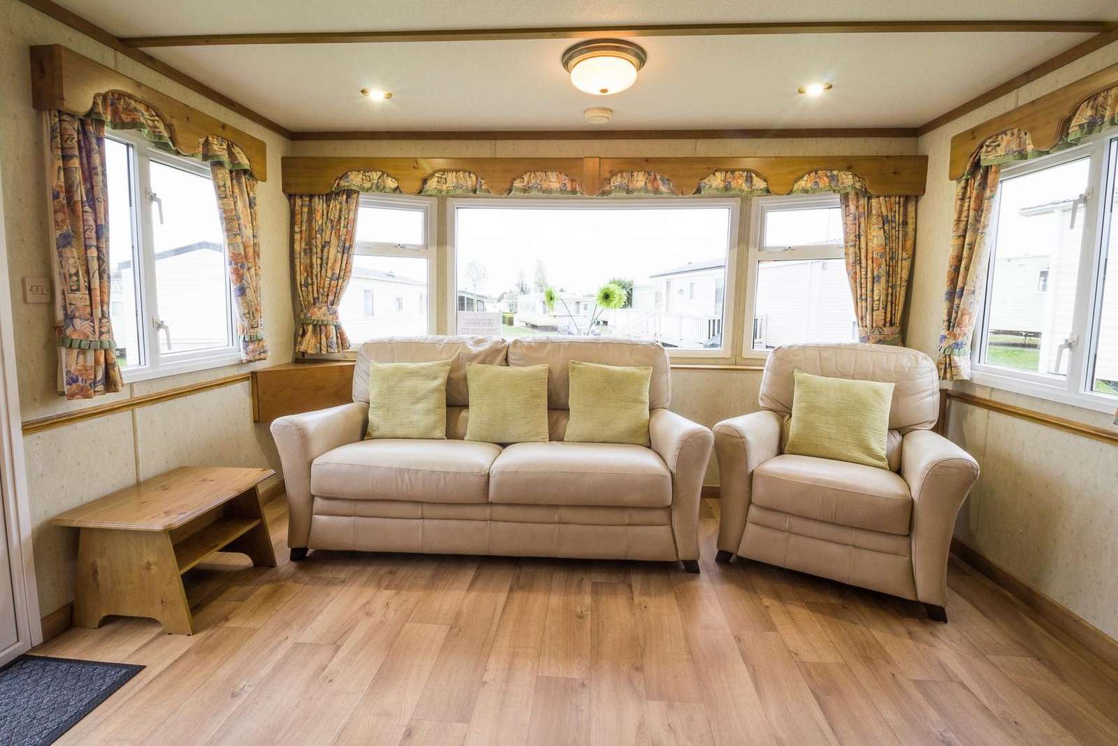 Large caravan for hire with comfortable seating.