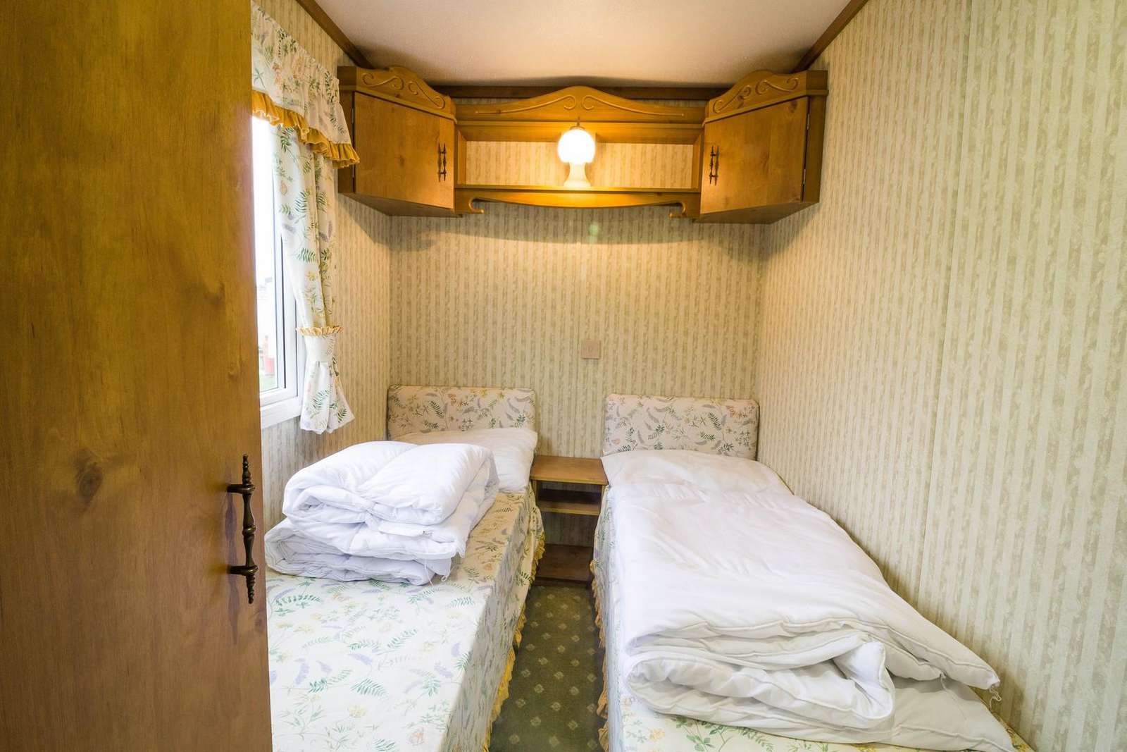 Twin room in this 3 bed roomed caravan for hire.