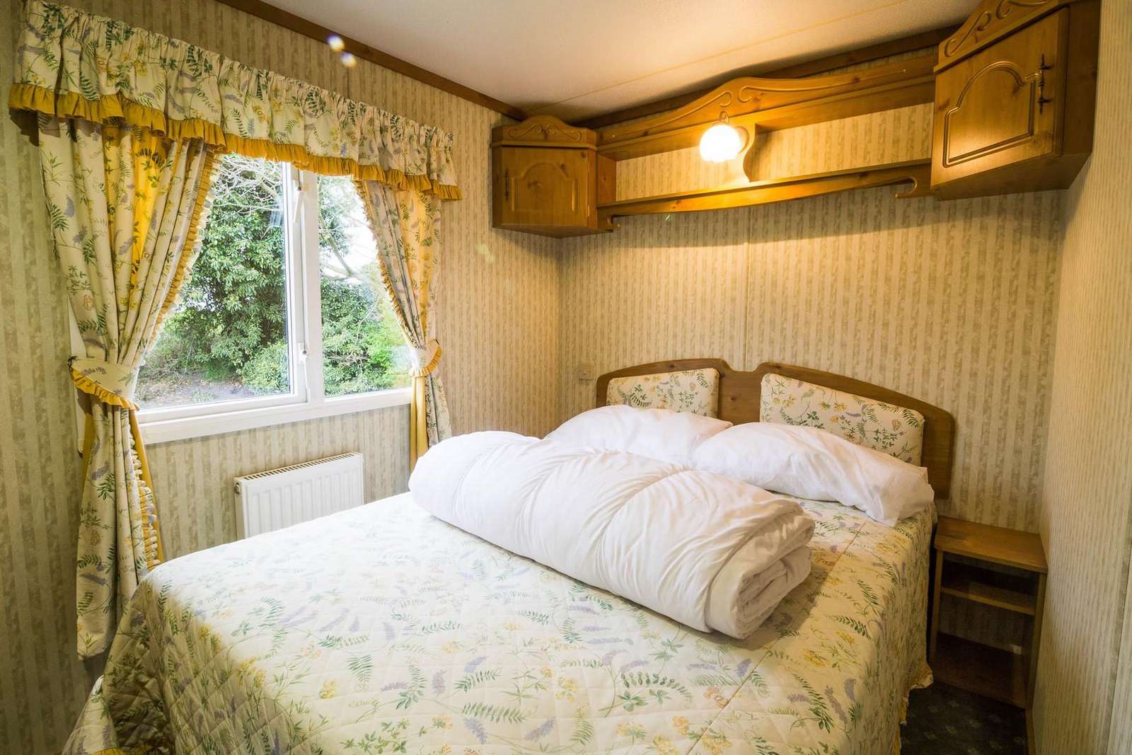Spacious double bedroom in this 3 bed roomed caravan for hire.