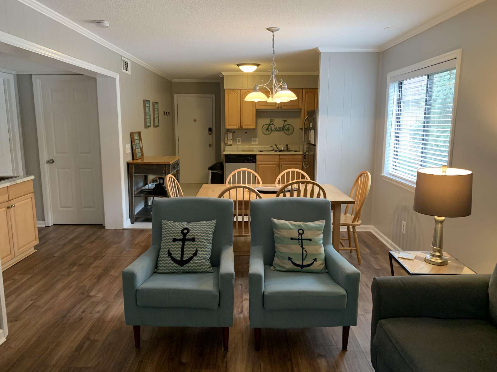 Beachy Open Floor Plan with Wide Plank Wood Floors