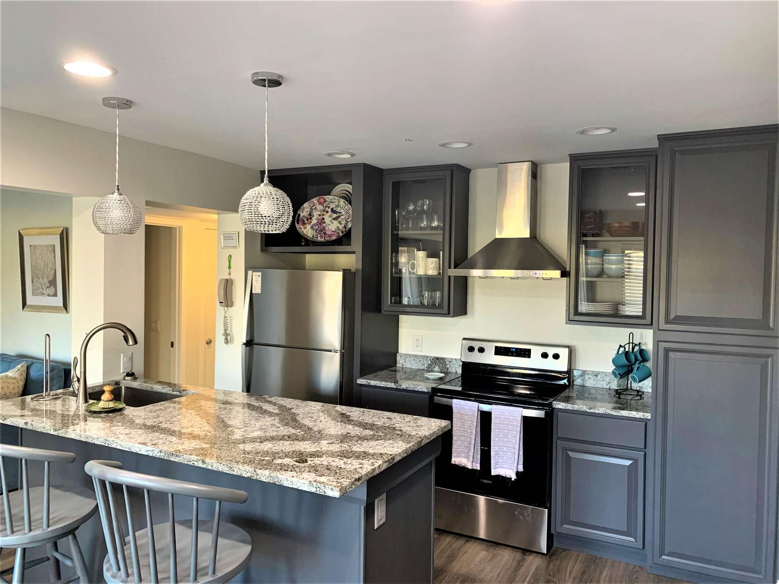 Beautiful Remodeled Kitchen with Granite Island and Stainless Steel Appliances