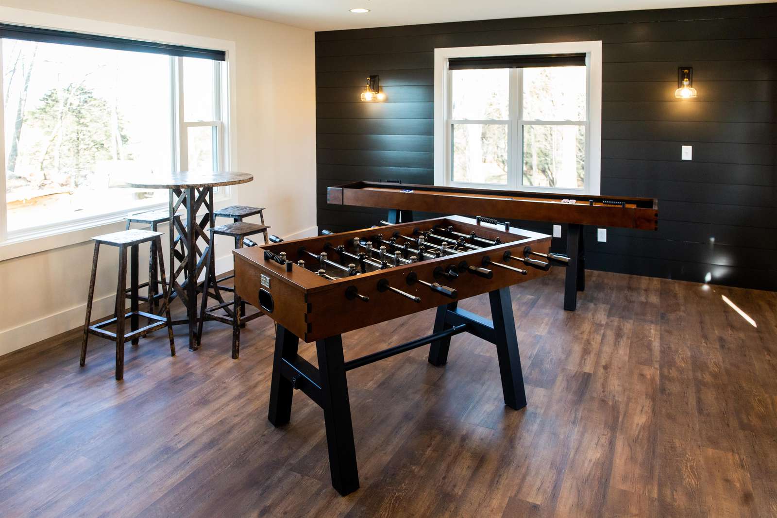 Foosball, shuffleboard, and more fill this community game room located directly behind The Homestead.