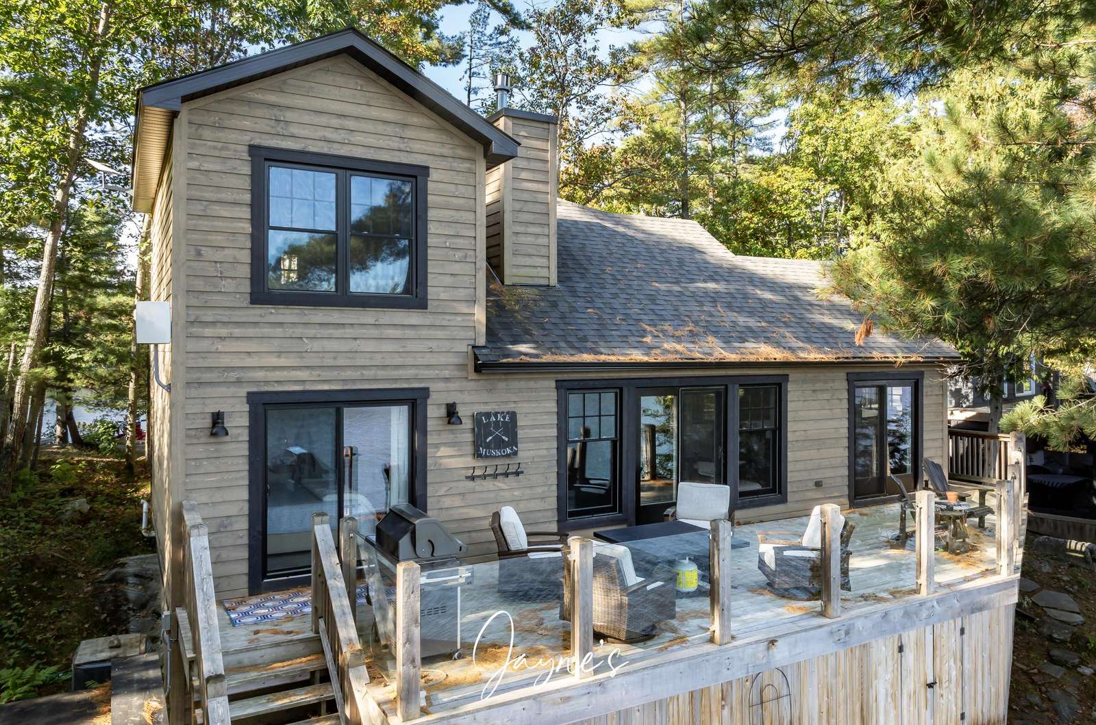 Spacious lakeside deck with cozy seating for sunset views