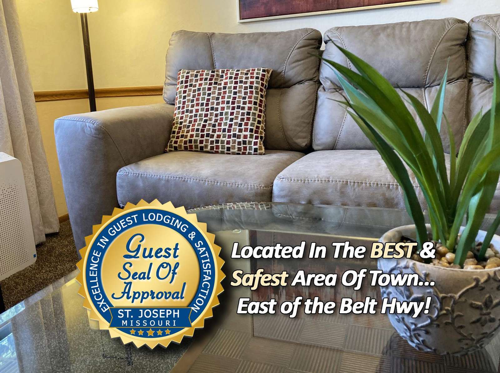 Cozy living room with plush seating and natural light - property