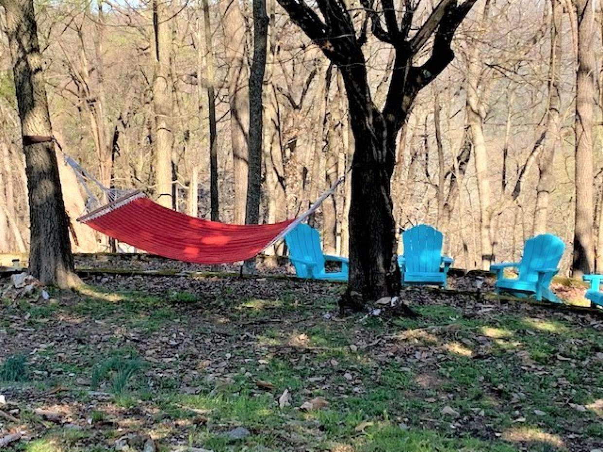 Outdoor area with seating and hammock