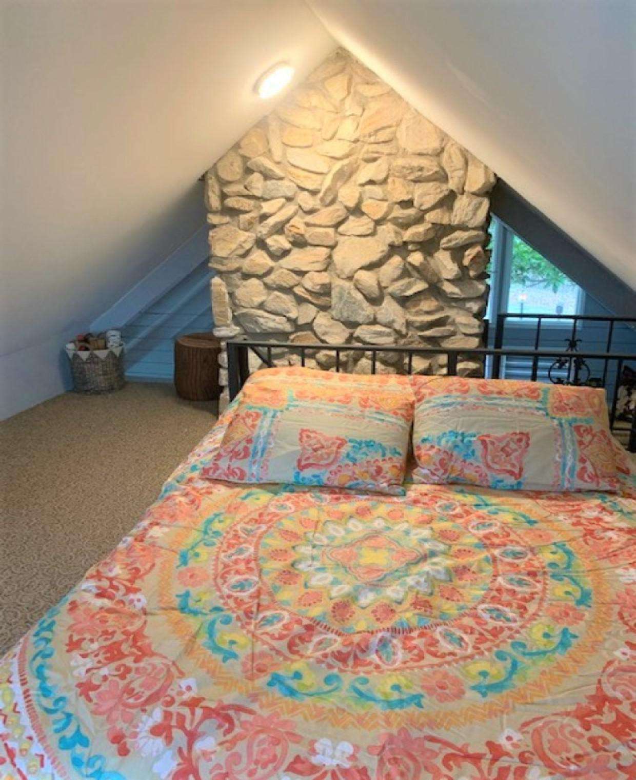 Loft bedroom with full bed