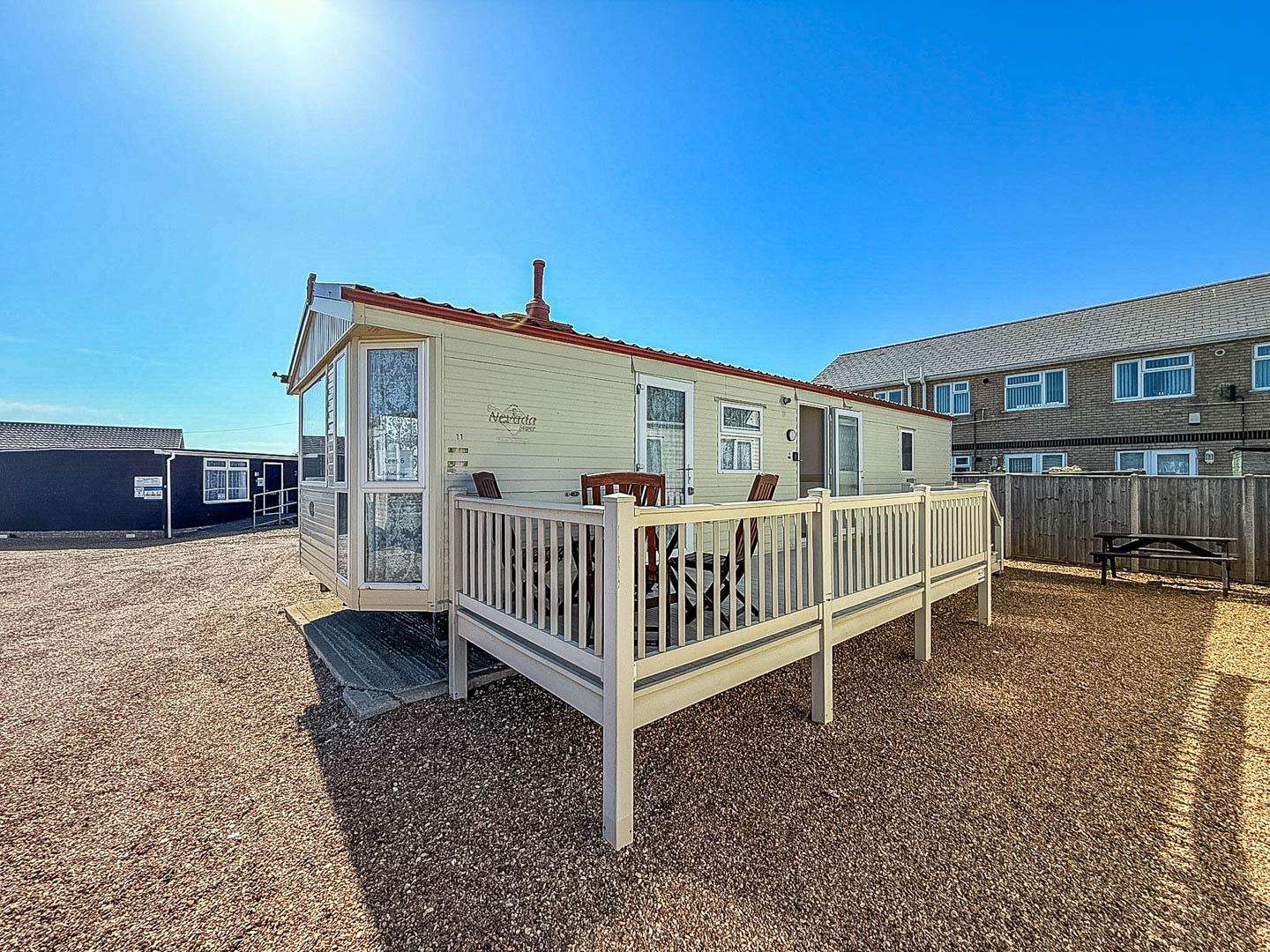 Lovely 6 berth caravan at Lee's Caravan Park in Hunstanton. The added decking is ideal for family holidays, providing a safe area for children. As a dog-friendly park, it also gives your pet a secure space to relax. - property