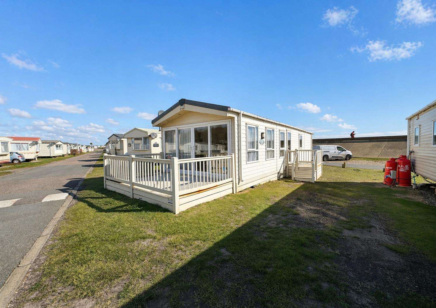 This modern caravan in Lowestoft with front decking is perfect for a weekend away. The beach is right behind the caravan making this the ideal base for your Suffolk adventure. - property