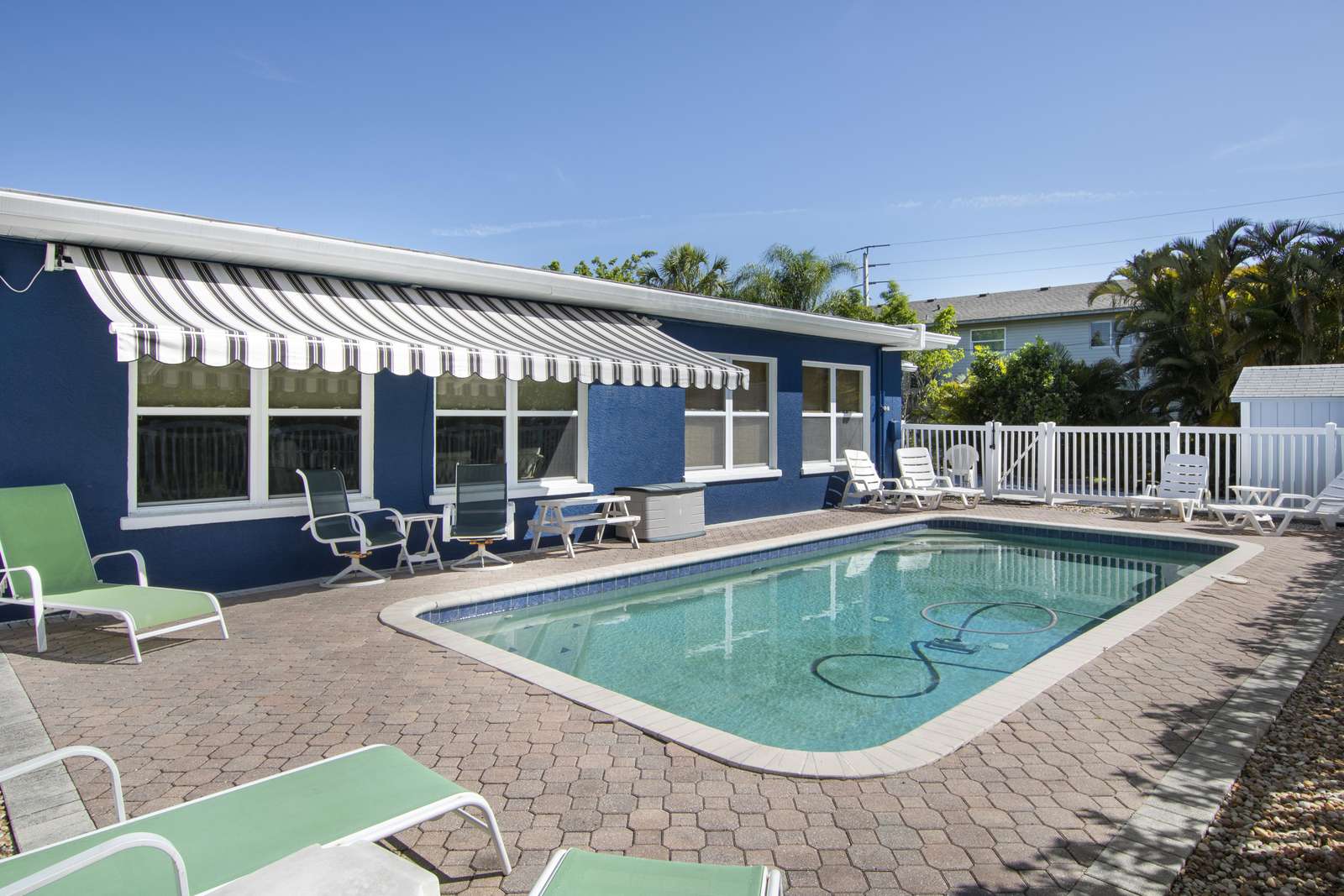 Heated pool and retractable awning