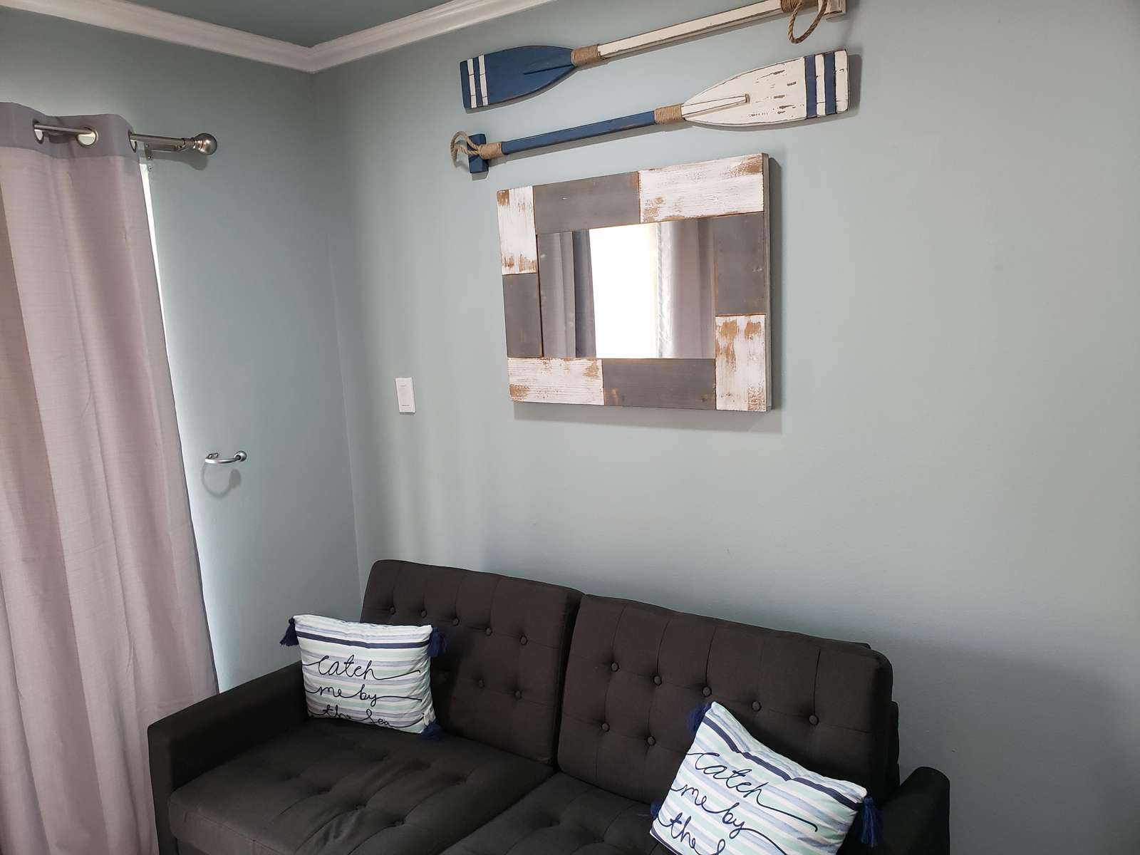 comfortable seating provided and a mounted 50 inch smart tv