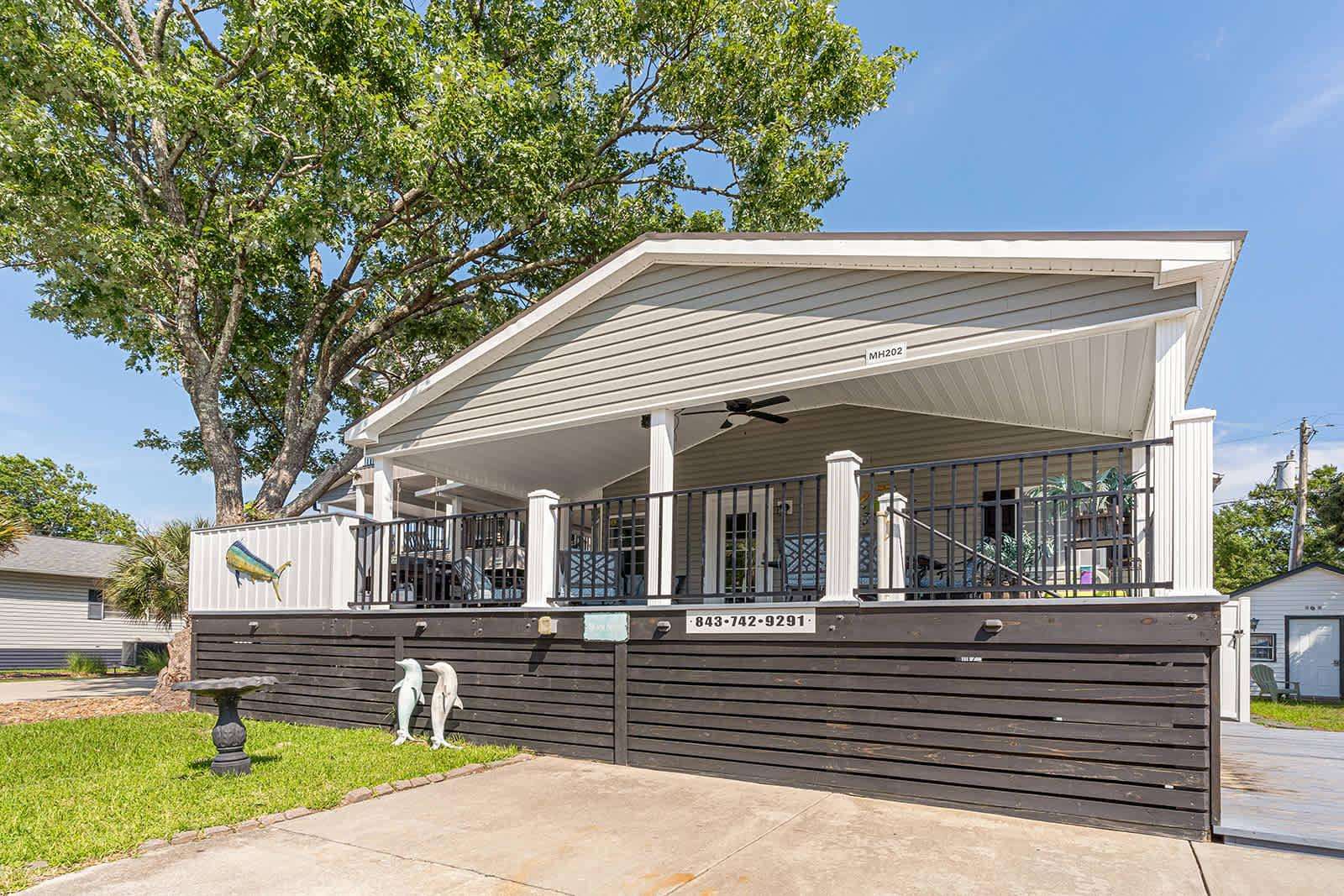 Spacious covered patio perfect for relaxing and entertaining - property